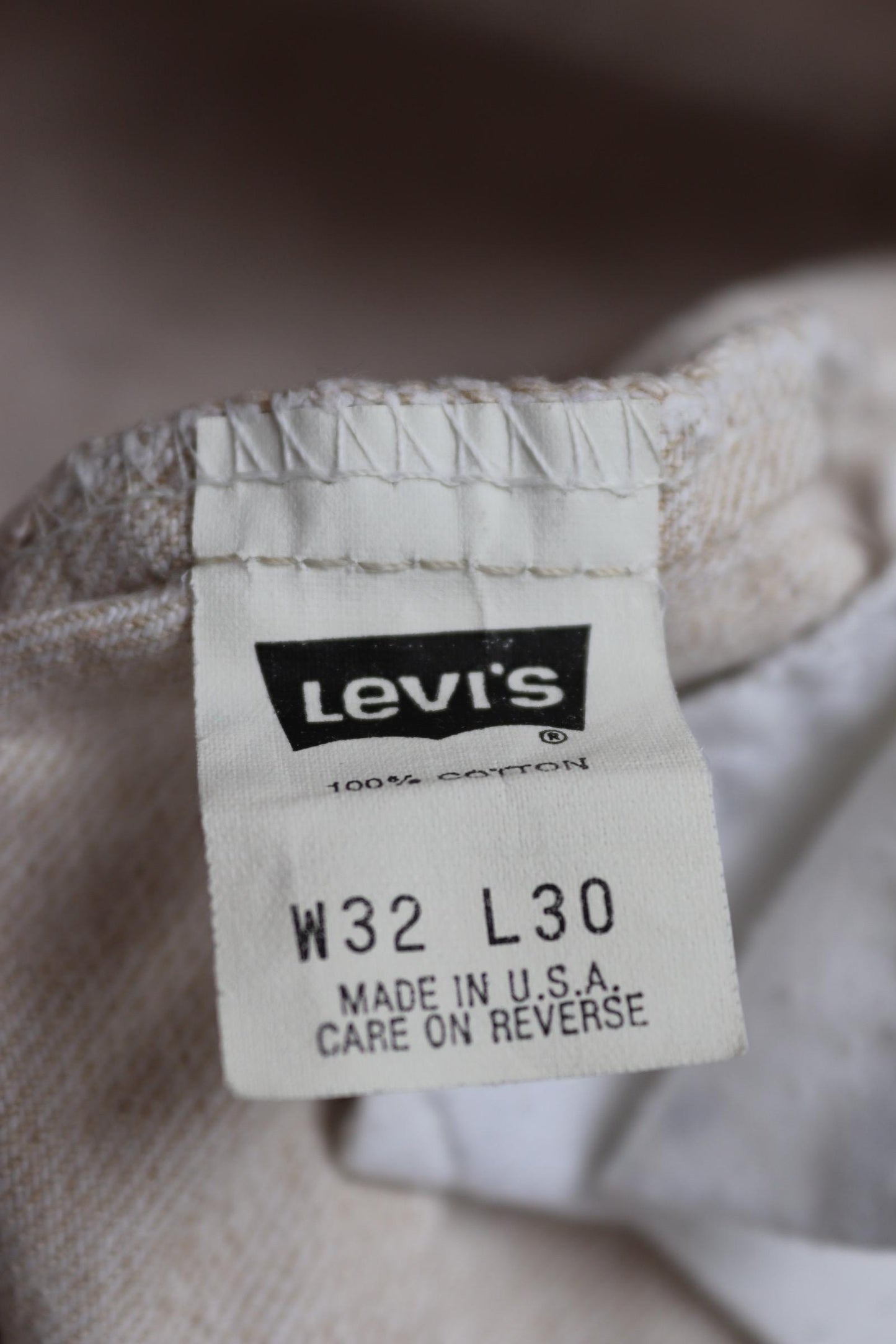 Vintage 1990s 90s Levis 550 Levi Strauss off white ecru red tab small e denim jeans button fly 31” x 30” mod made in USA