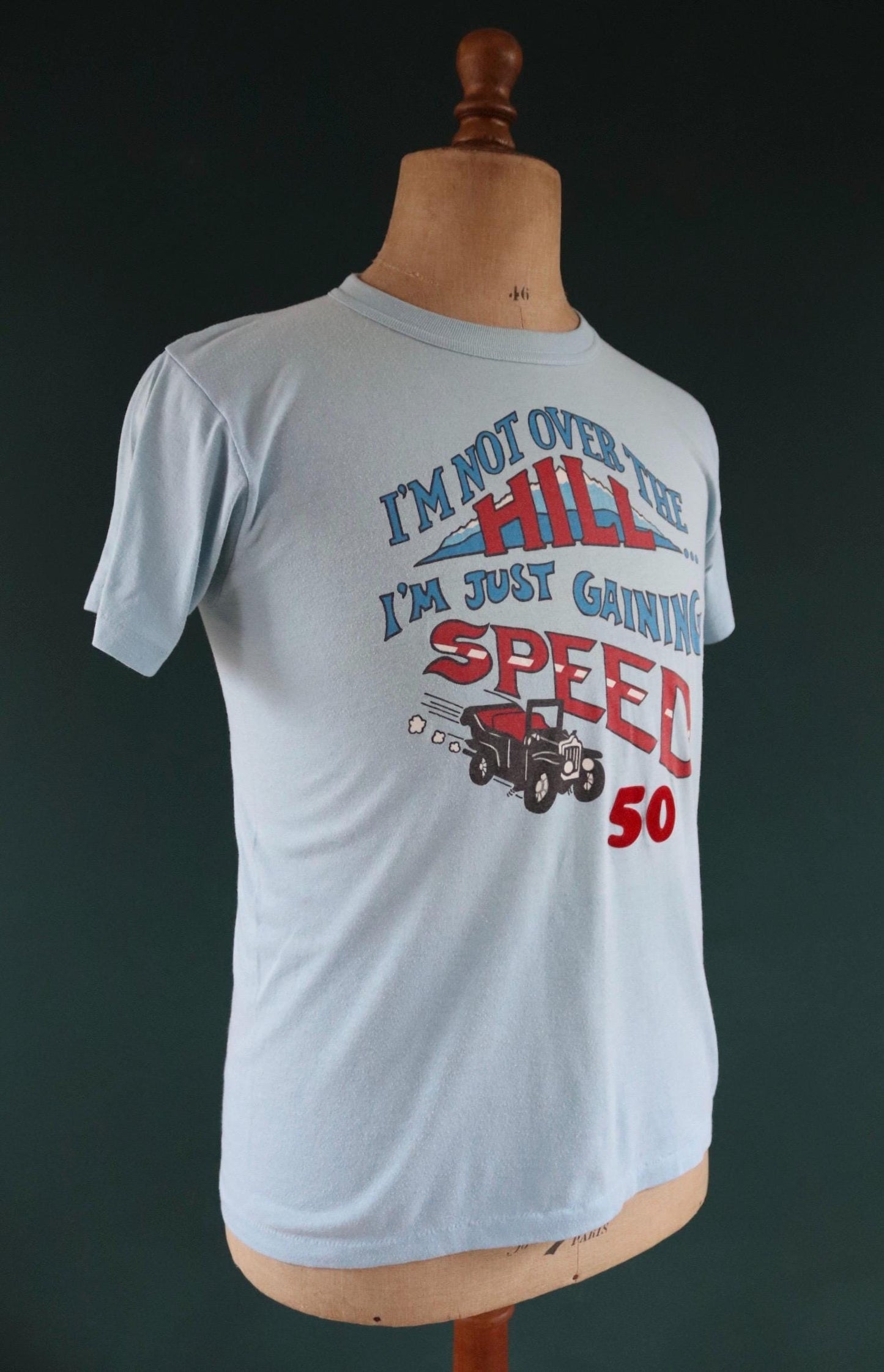 Vintage 1970s 70s 1980s 80s sky blue poly cotton 50th birthday souvenir Charlie over the hill sports sportswear t shirt 38” chest