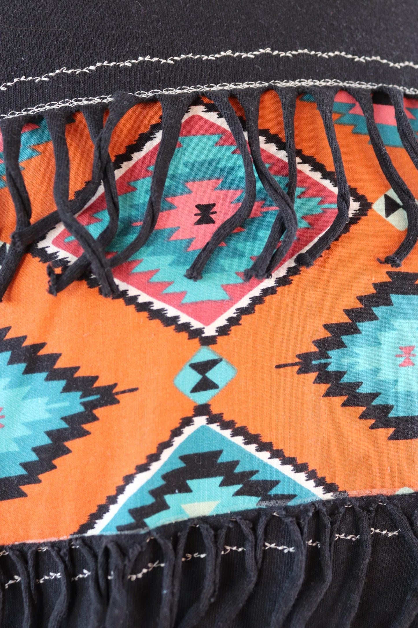 Vintage 1990s faded black t shirt - Aztec style design with tassels - 43” chest