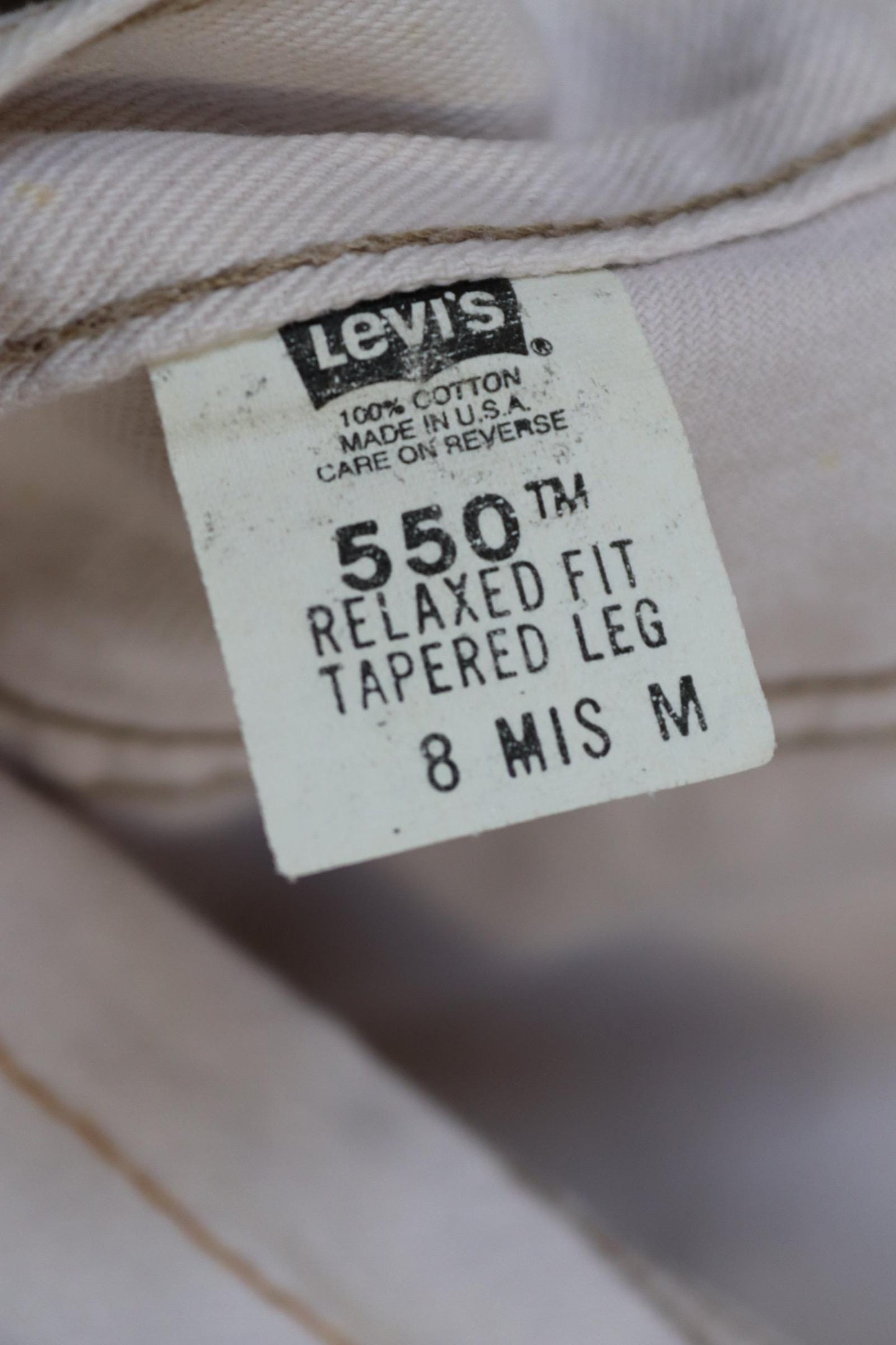 Vintage 1990s Levis 550 white denim jeans - Levi Strauss red tab - barrel leg - small e - zip fly - 29” x 38”