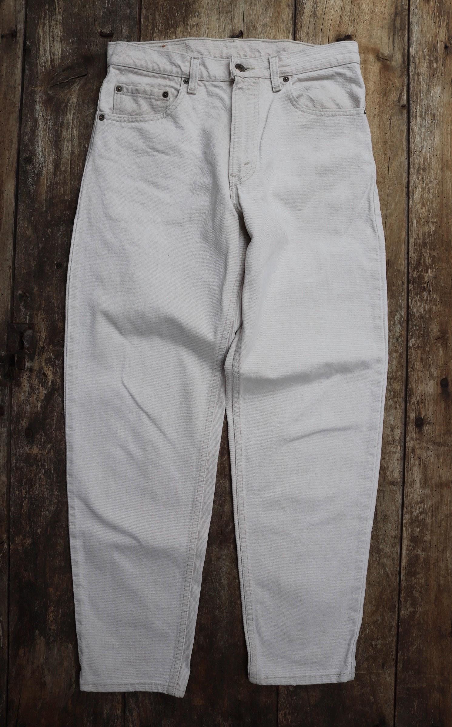 Vintage 1990s 90s Levis 550 Levi Strauss off white ecru red tab small e denim jeans button fly 31” x 30” mod made in USA
