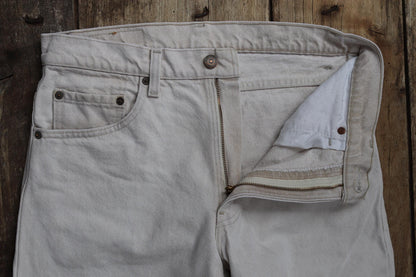 Vintage 1990s 90s Levis 550 Levi Strauss off white ecru red tab small e denim jeans button fly 31” x 30” mod made in USA