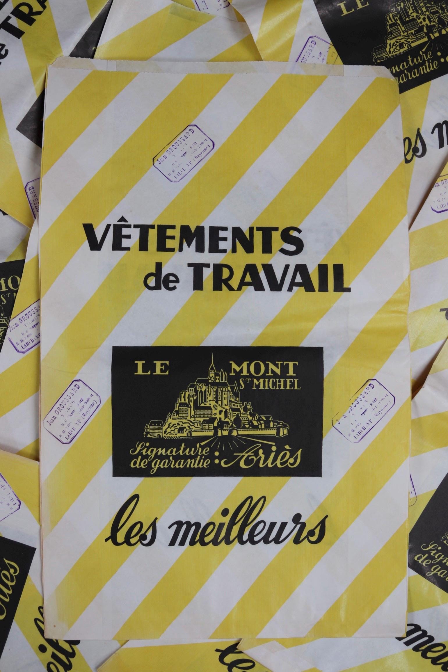 Vintage 1950s French paper print art Le Mont St Michel yellow white striped bag advertising stamped workwear work chore display collectible