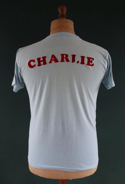 Vintage 1970s 70s 1980s 80s sky blue poly cotton 50th birthday souvenir Charlie over the hill sports sportswear t shirt 38” chest