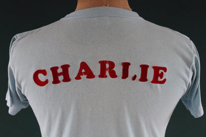 Vintage 1970s 70s 1980s 80s sky blue poly cotton 50th birthday souvenir Charlie over the hill sports sportswear t shirt 38” chest