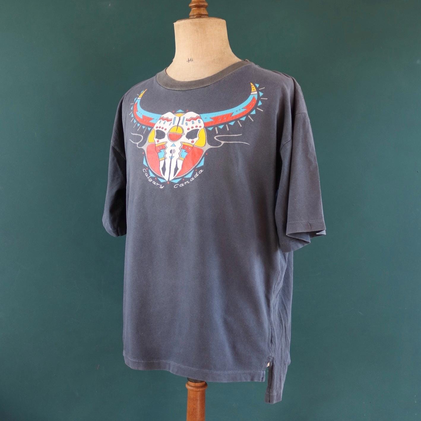 Vintage 1990s oversized t shirt - Calgary Canada - cow skull design - faded black - 48” chest