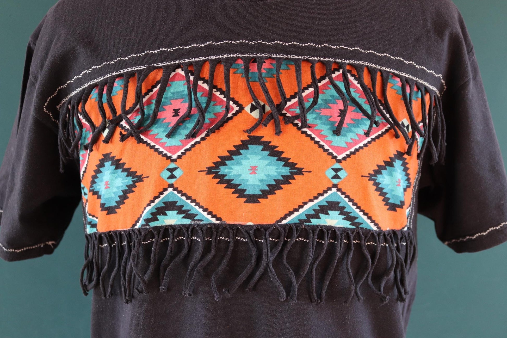 Vintage 1990s faded black t shirt - Aztec style design with tassels - 43” chest