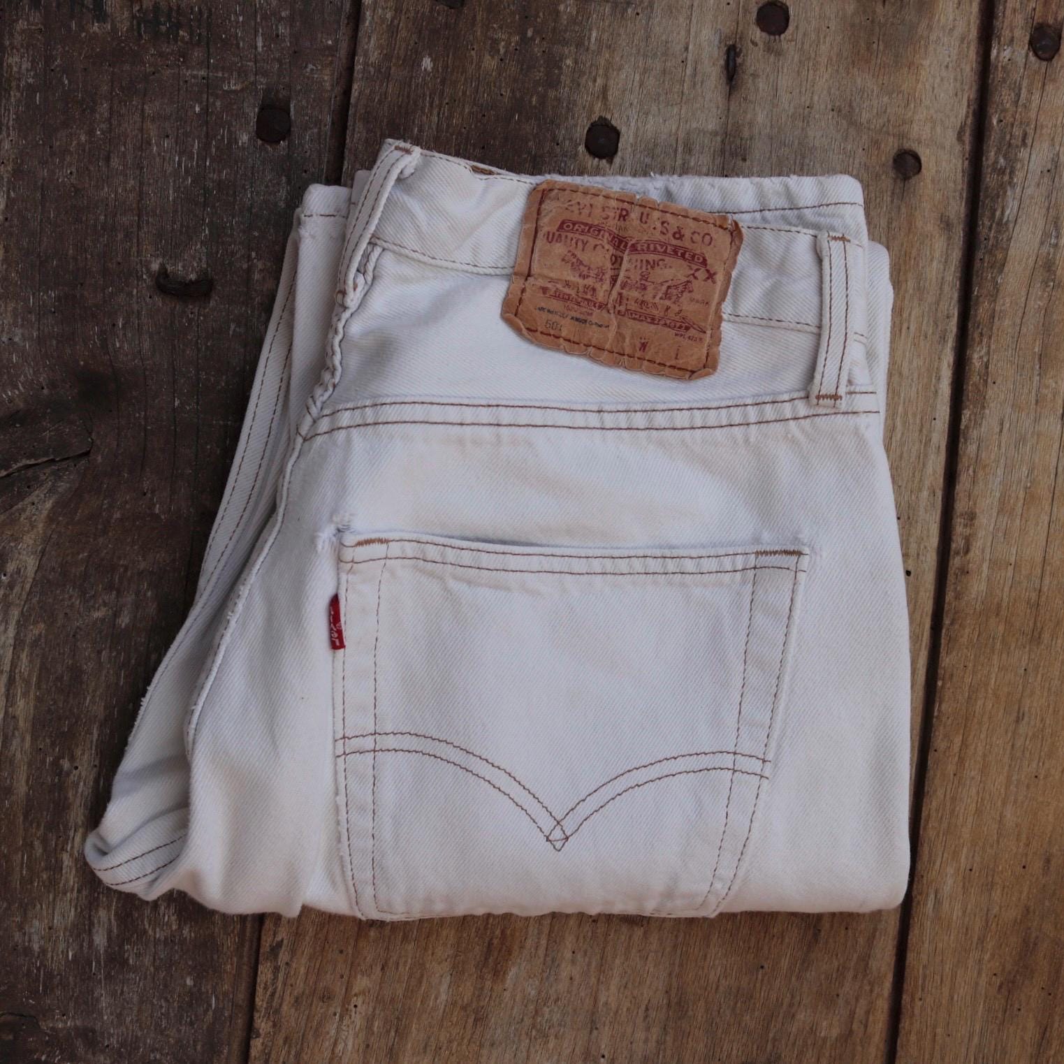 Vintage 1990s white denim Levis 501 jeans - Levi Strauss red tab - small e - 27” x 30”