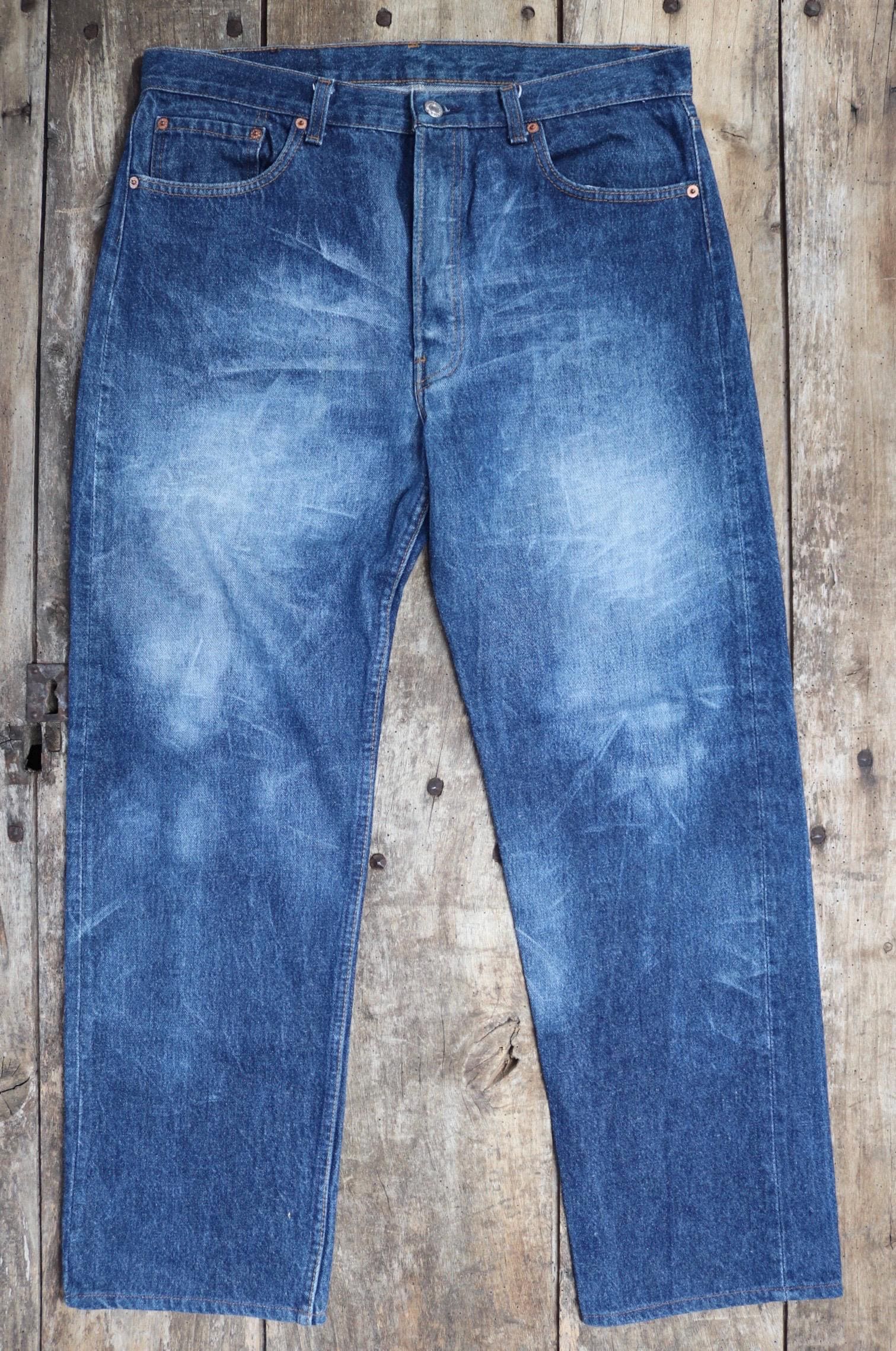 Vintage 1980s Levis 501 denim jeans - made in USA - small e red tab - 35” x 30”