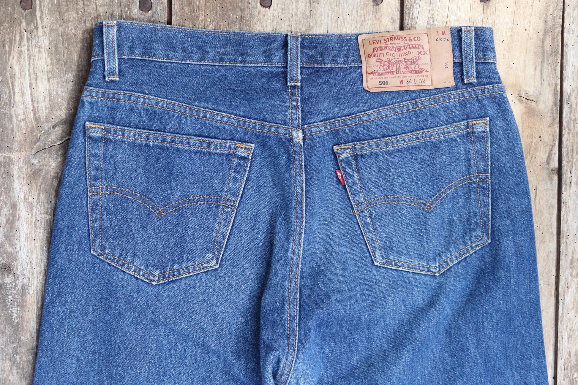 Vintage 1990s Levis 501 denim jeans - made in USA - small e red tab - 33” x 32”