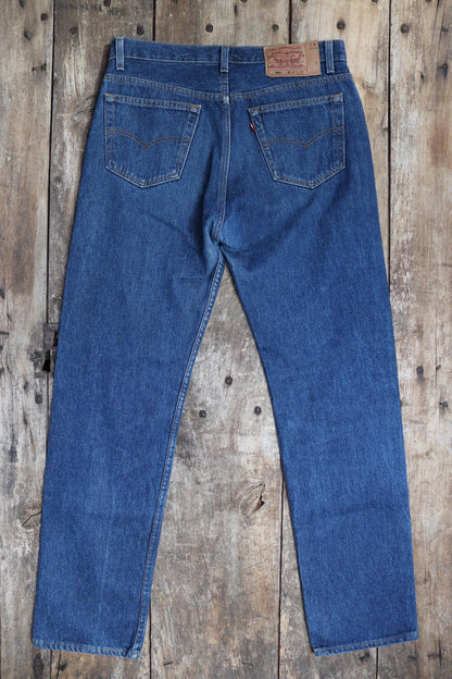 Vintage 1990s Levis 501 denim jeans - made in USA - small e red tab - 33” x 32”