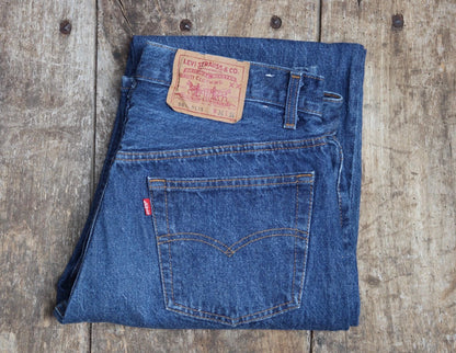 Vintage 1980s Levis 501 denim jeans - made in USA - small e red tab - 33” x 34”