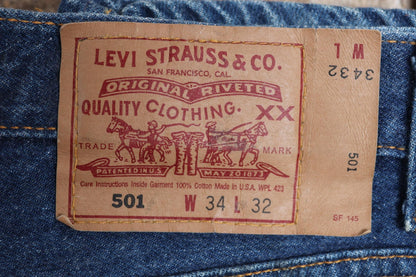 Vintage 1990s Levis 501 denim jeans - made in USA - small e red tab - 33” x 32”
