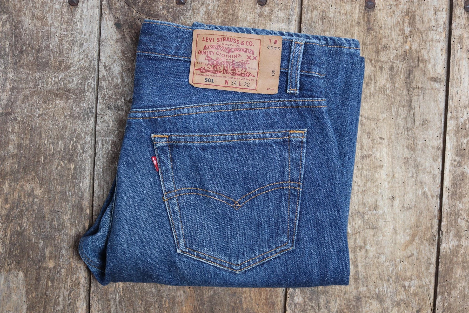 Vintage 1990s Levis 501 denim jeans - made in USA - small e red tab - 33” x 32”