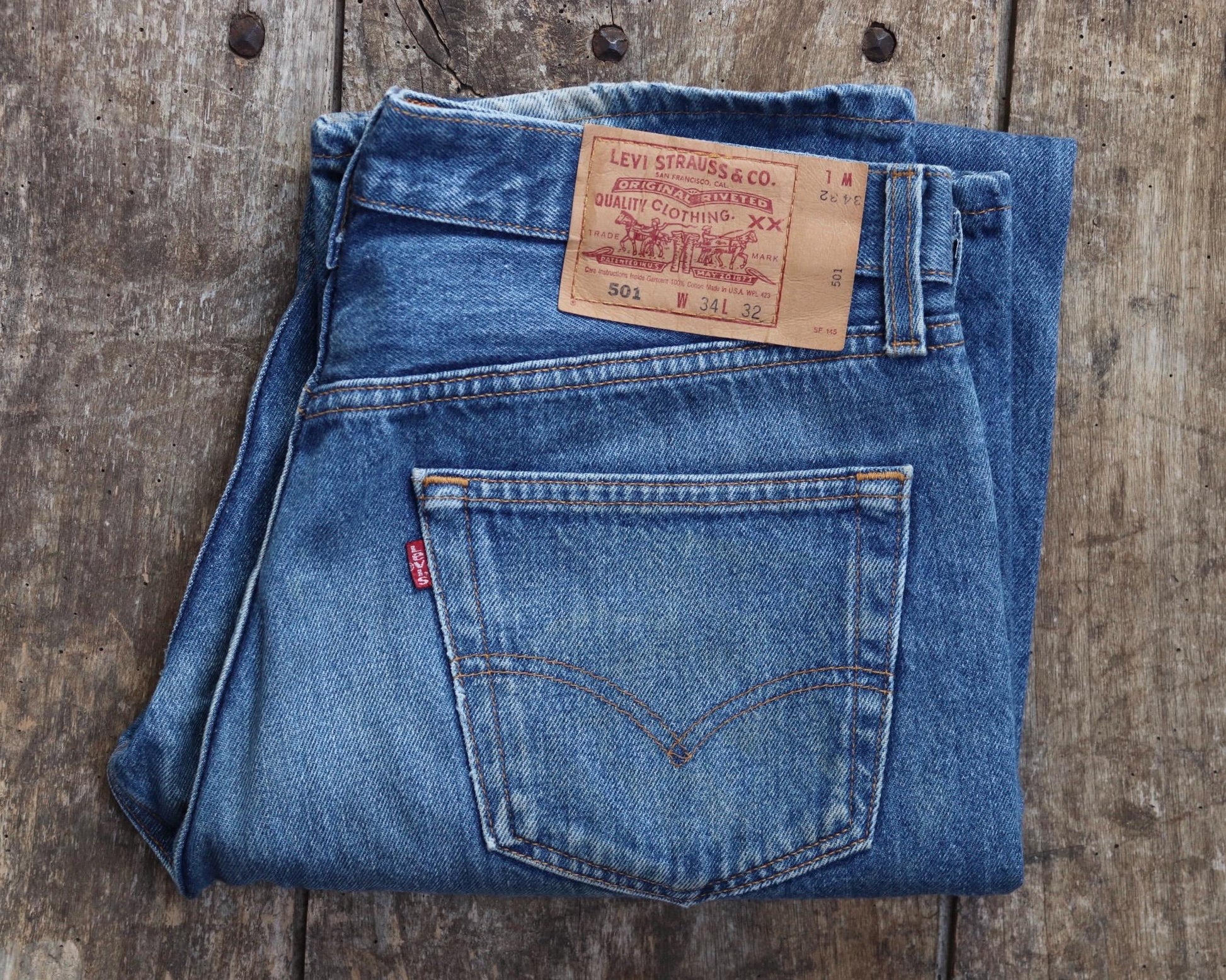 Vintage 1990s Levis 501 denim jeans - made in USA - small e red tab - 33” x 32”
